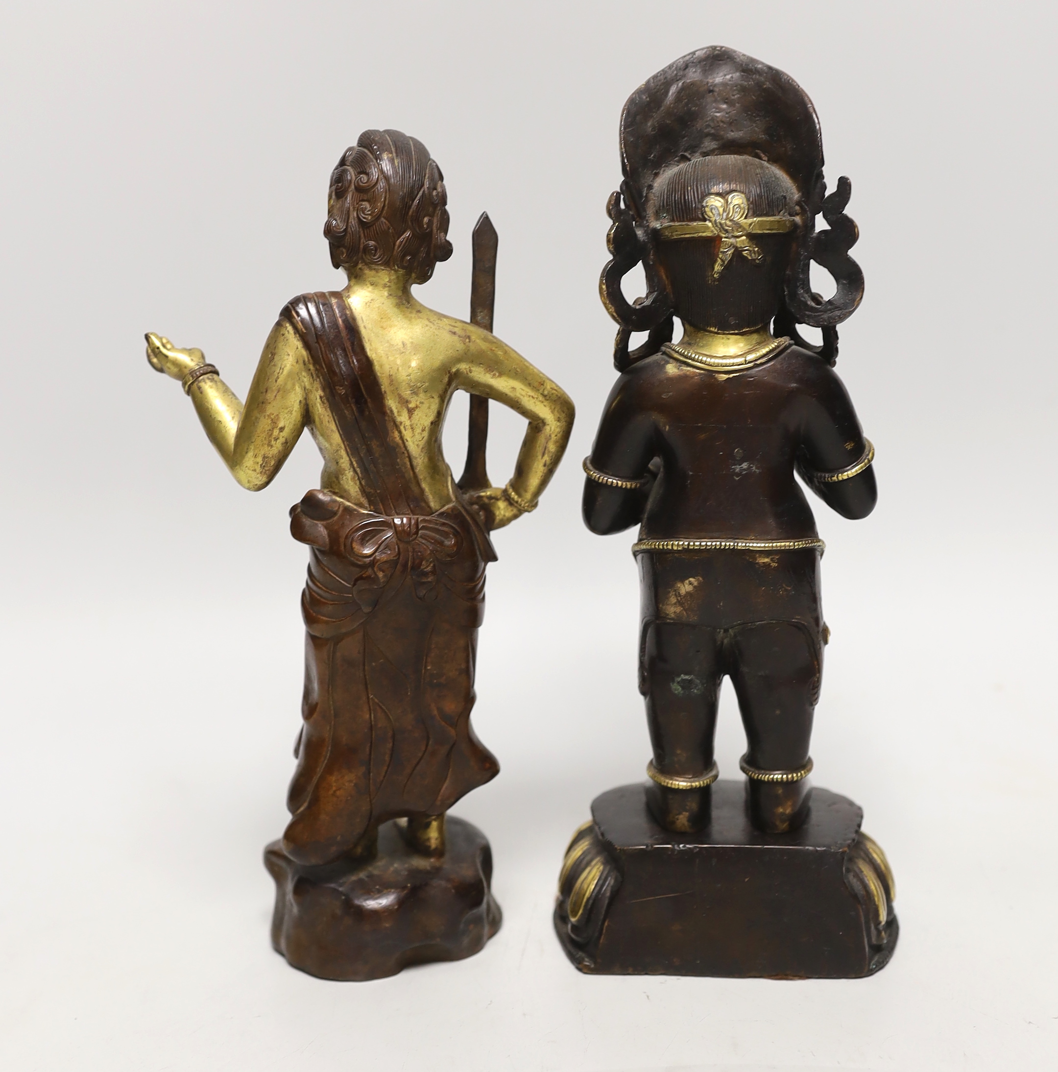 A pair of Sino-Tibetan gilt bronze figures, tallest 24cm